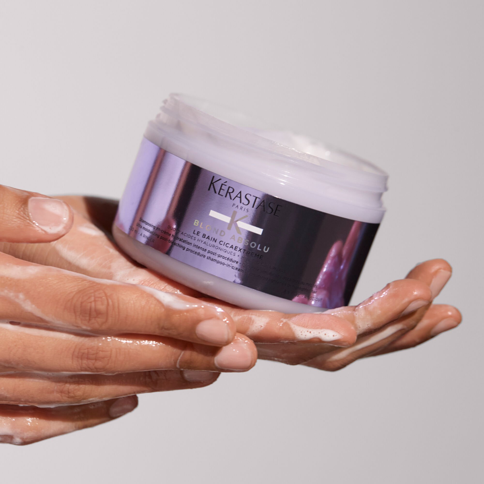 kerastase blond absolu le bain cicaextreme shampoo product in hand
