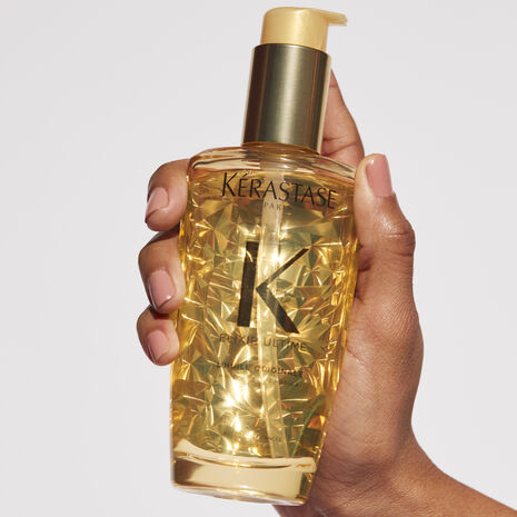 Kerastase Elixir Ultime L'Huile Original Hair Oil in hand