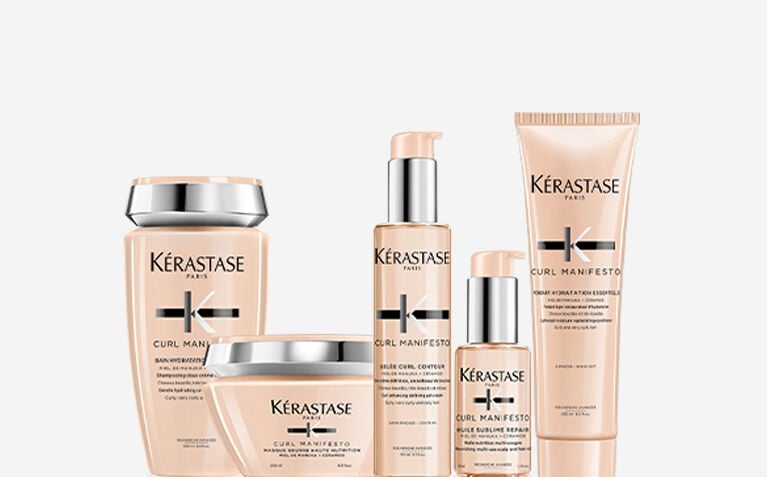 Kerastase Curl Manifesto model with products for curly and coily hair.