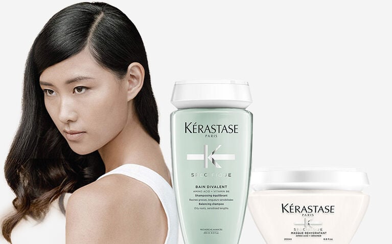 Kerastase Specifique model with hair care products for unbalanced scalps.